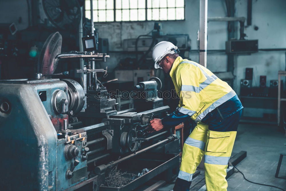 Similar – Man cutting iron