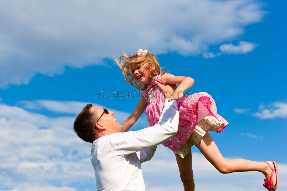 Similar – Image, Stock Photo Father and son playing in the park at the day time. Concept of friendly family. Picture made on the background of blue sky.