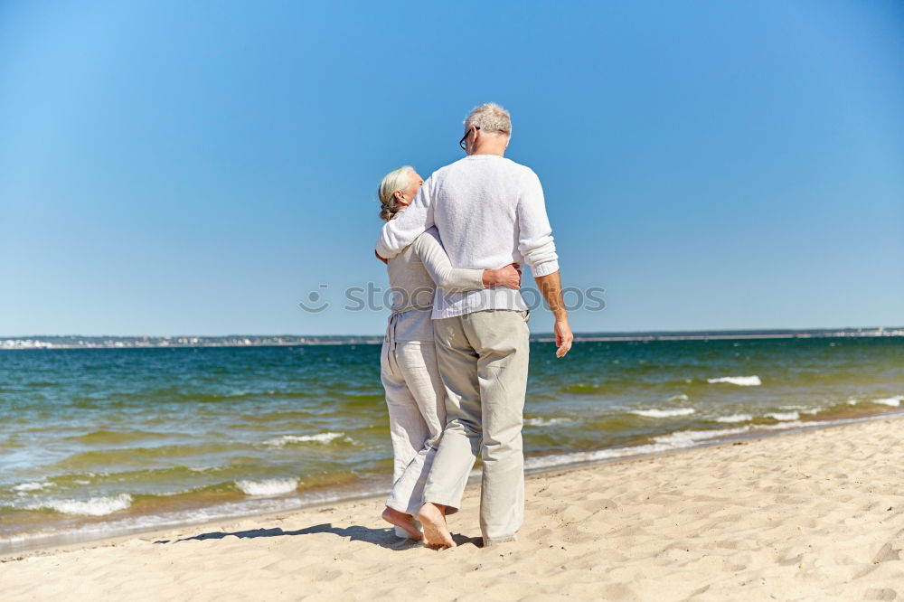 Similar – Father and daughter playing on the beach at the day time.