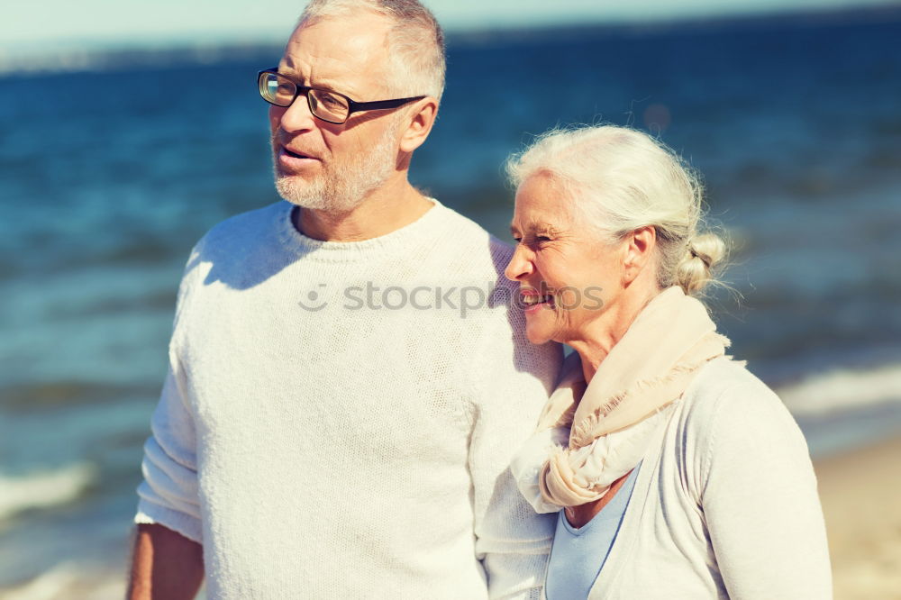 Similar – Senior man and woman having a run along the shore. Scene with sea, sand and trees. Healthy and active way of life