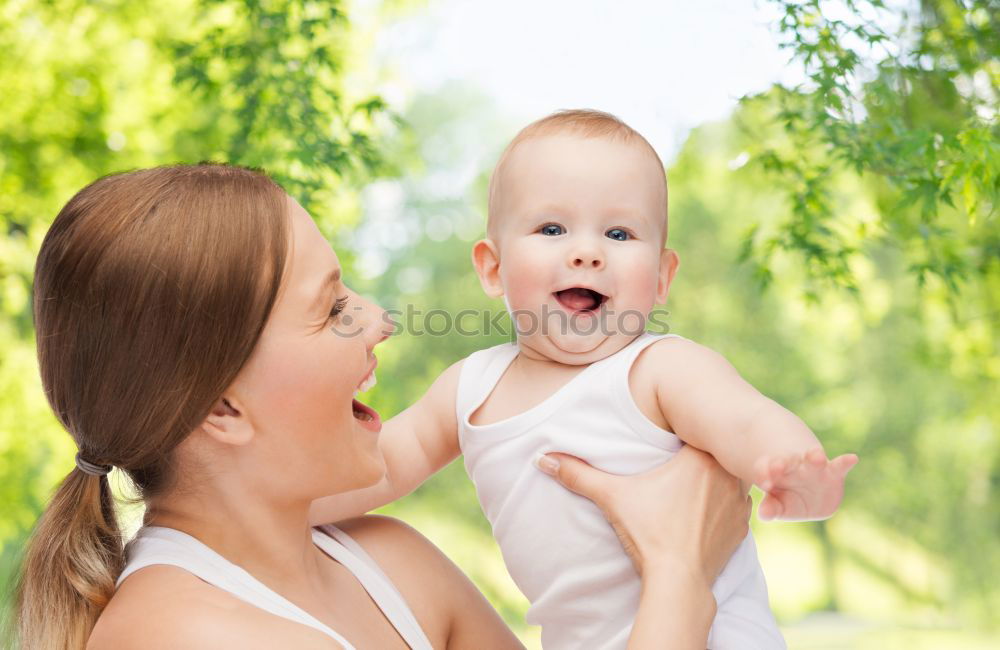 Similar – Image, Stock Photo Back view of mother holding baby girl in her arms