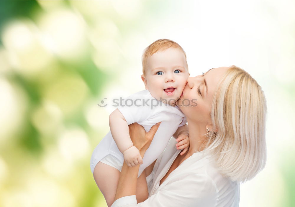 Similar – Image, Stock Photo Young happy mother embraced her cute little girl at canola field