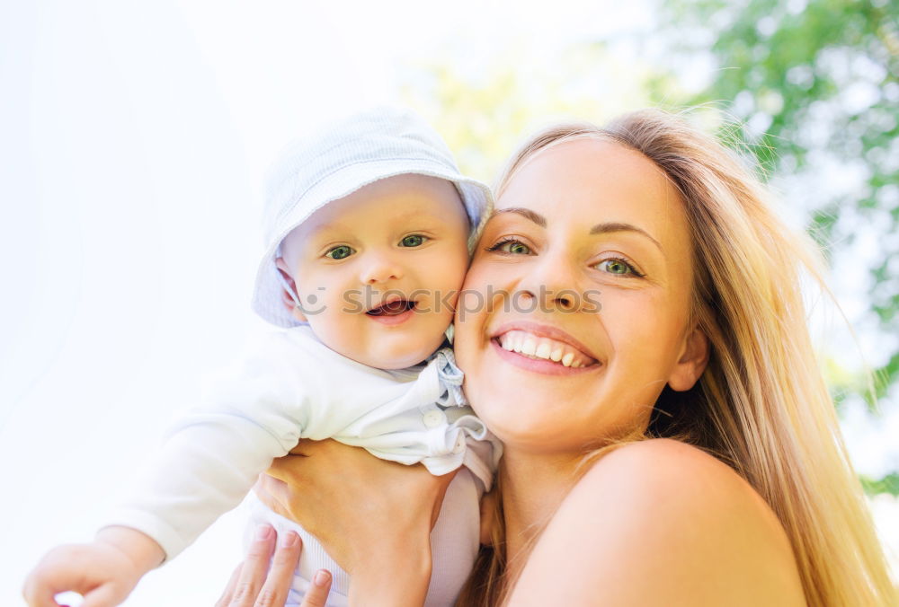 Similar – Image, Stock Photo Young happy mother embraced her cute little girl at canola field