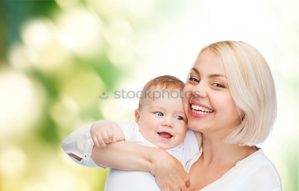 Similar – Image, Stock Photo Young happy mother embraced her cute little girl at canola field