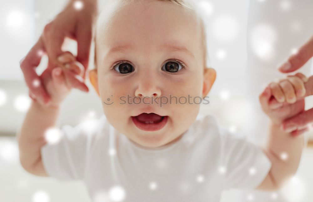 Similar – Baby looks in the mirror and discovers his reflection