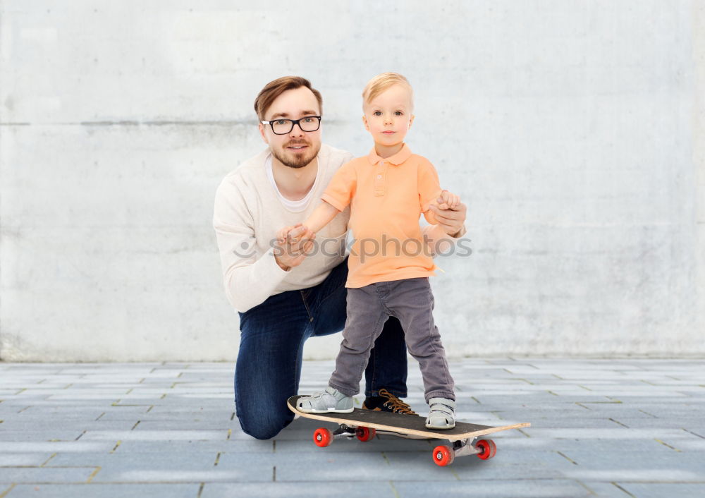 Image, Stock Photo Father and son playing on the road at the day time. People having fun outdoors. Concept of friendly family.