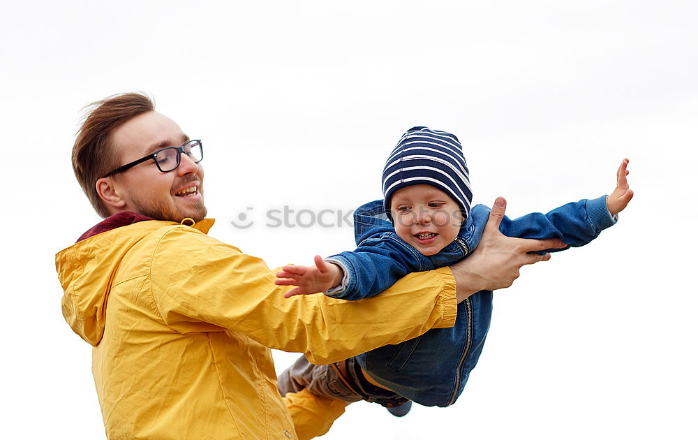 Similar – Father and son standing on the road at the day time.