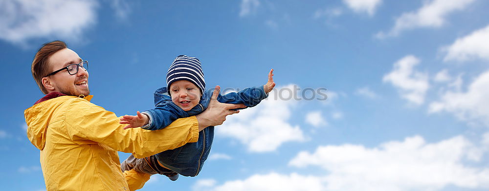 Similar – Image, Stock Photo Father and son playing on the beach at the day time. They are dressed in sailor’s vests. Concept of sailors on vacation and friendly family.