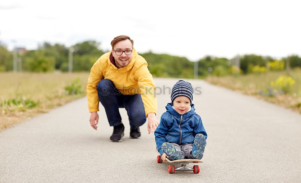 Similar – Father and daughter playing on the road at the day time.