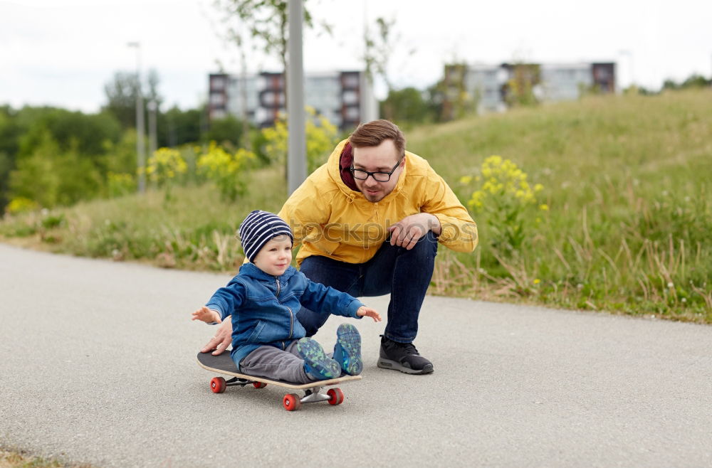 Similar – Father and daughter playing on the road at the day time.