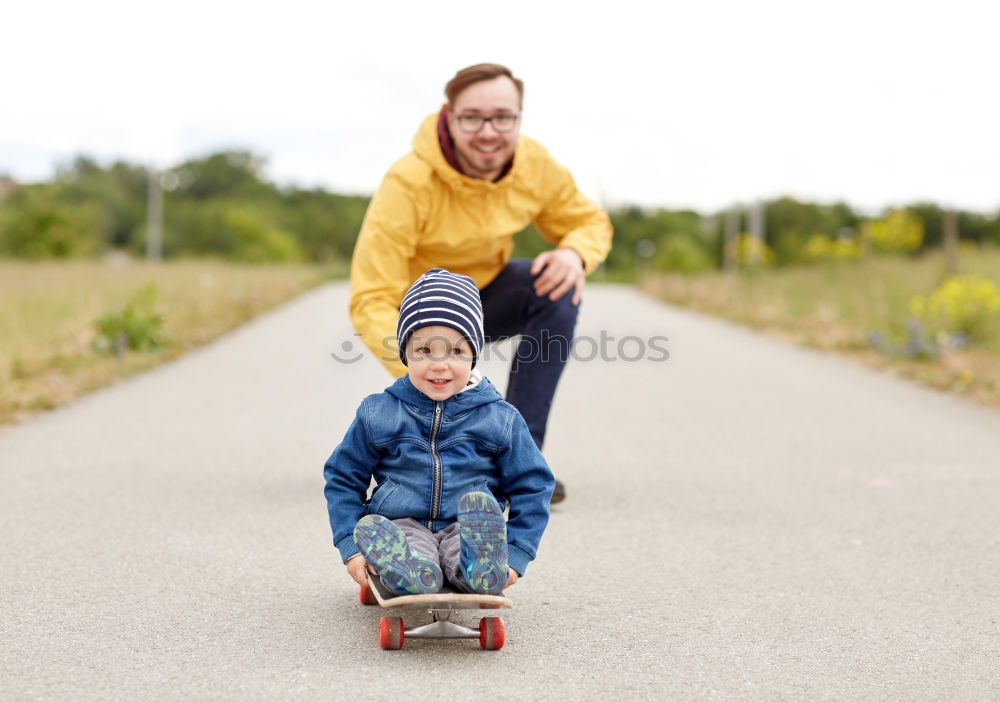 Similar – Father and daughter playing on the road at the day time.