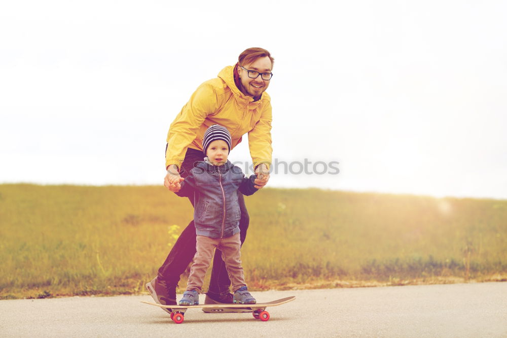 Similar – Image, Stock Photo Father and son standing on the road at the day time.