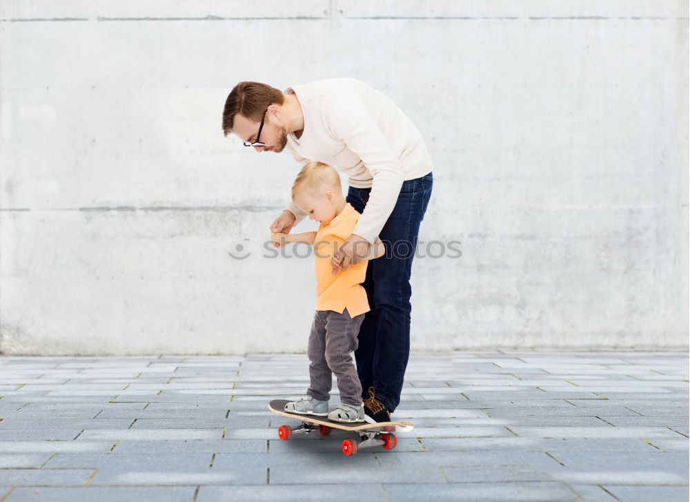 Similar – Father and daughter playing on the road at the day time.