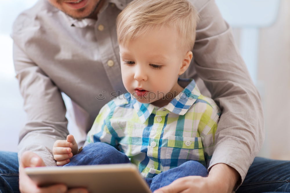 Similar – happy mother and toddler son using tablet