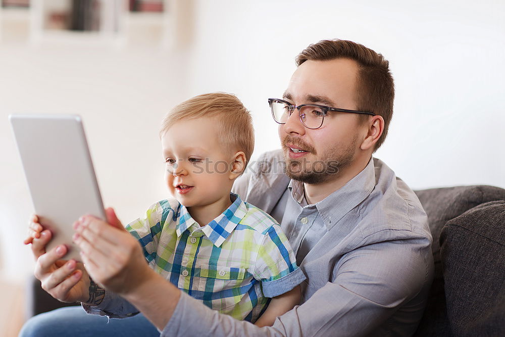 Similar – happy mother and toddler son using tablet