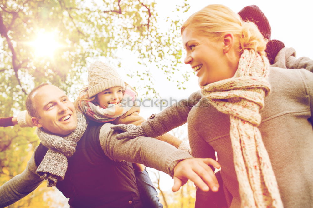 Similar – Young couple under blanket with hot drink kissing outdoors