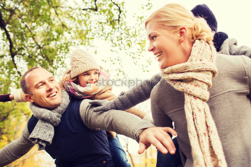 Similar – Young couple under blanket with hot drink kissing outdoors