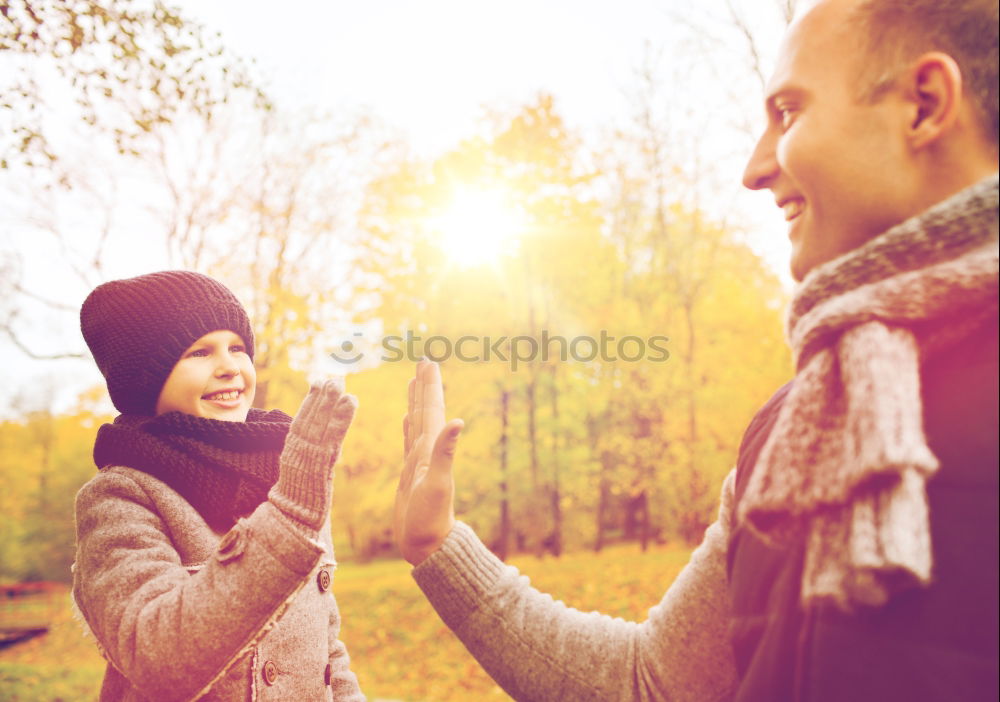 Similar – Young couple under blanket having hot drink in a cold day