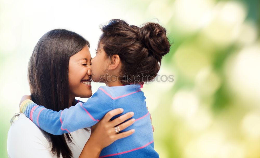 Similar – Image, Stock Photo Happy mother kissing her daughter enjoying a winter afternoon