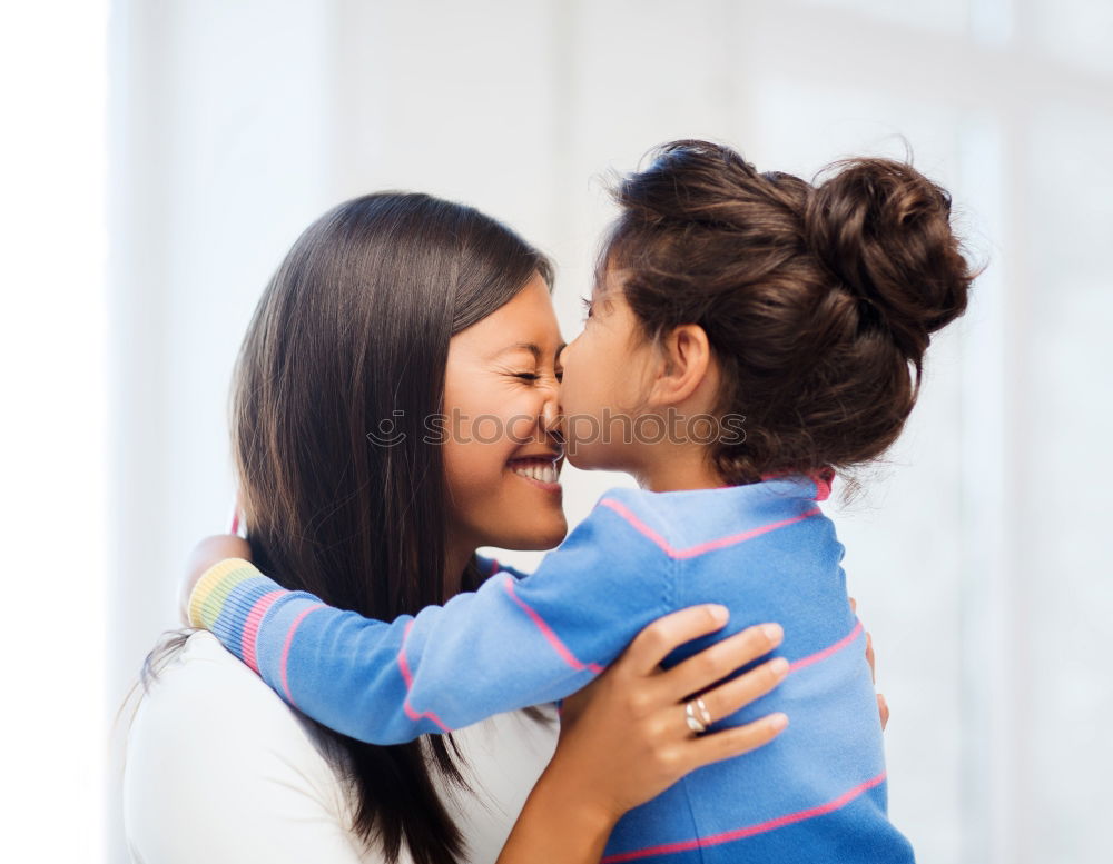 Similar – Kissing mother and daughter in summer