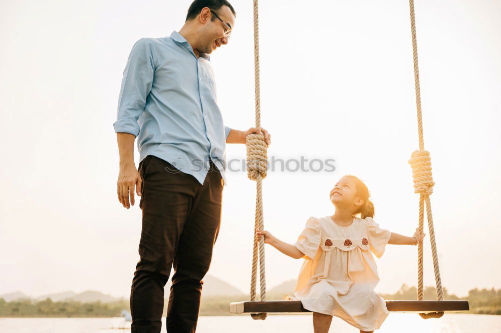 Similar – Image, Stock Photo Father and son playing at the park near lake at the day time.