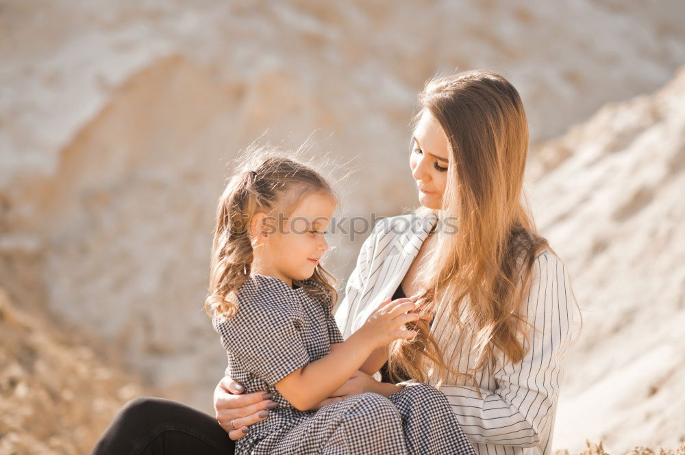 Similar – Image, Stock Photo Young adult mom giving toddler kiss on cheek