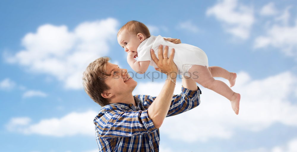 Similar – Father and son playing in the park at the day time.