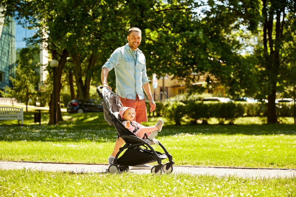 Similar – Foto Bild Oma spielt mit ihrem Enkel im Kinderwagen im Garten.