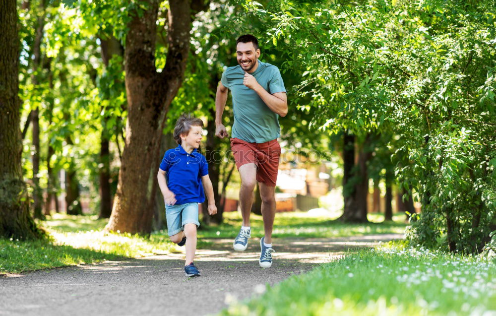 Similar – Image, Stock Photo Father and son playing on the road at the day time. People having fun outdoors. Concept of friendly family.