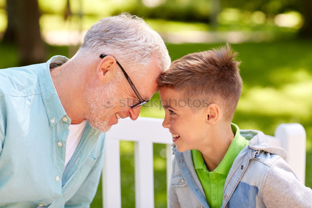 Similar – Image, Stock Photo Senior man and child reading a newspaper outdoors