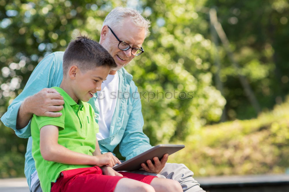 Similar – Image, Stock Photo Senior man and child reading a newspaper outdoors