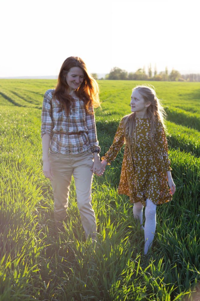 Similar – Granny sitting with her grandson on a meadow in nature