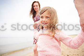 Sister and brother playing on the beach