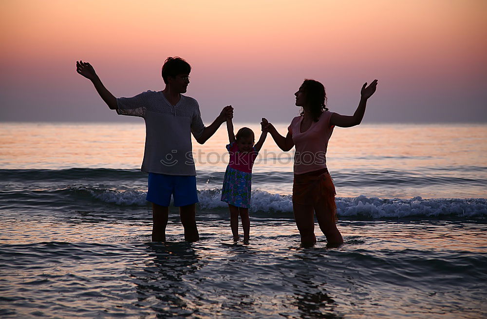 Similar – Happy children playing on the beach at the sunset time. Three Kids having fun outdoors. Concept of summer vacation and friendly family.