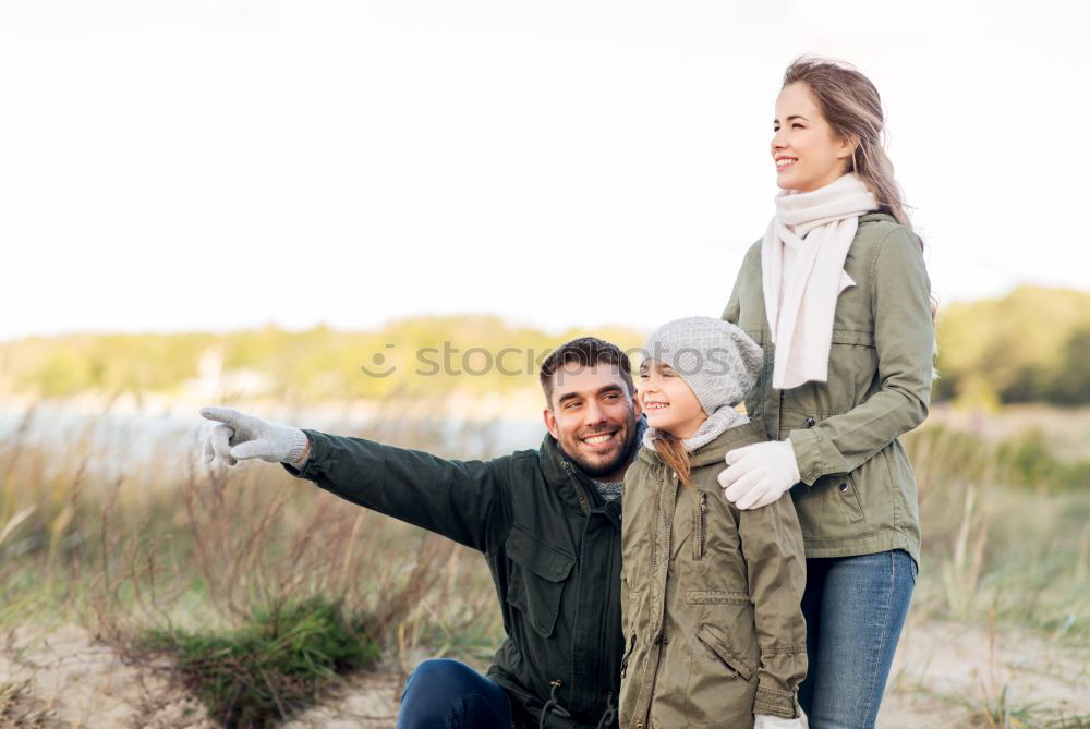 Young couple taking selfie photo with smartphone outdoors