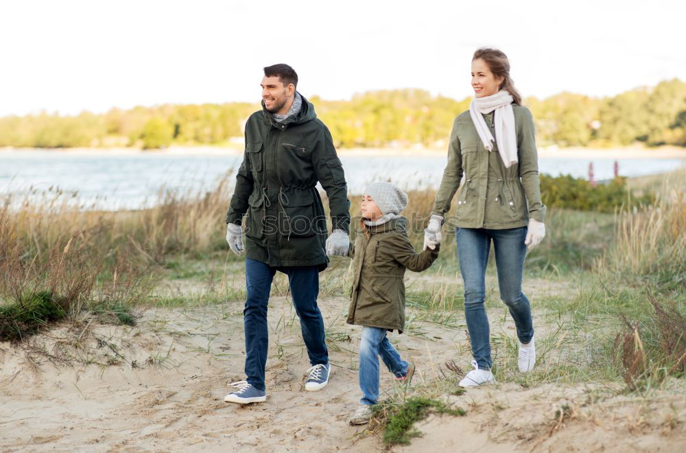 Image, Stock Photo Happy family walking together holding hands in the forest