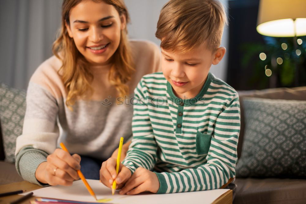 Similar – happy mother and toddler son using tablet