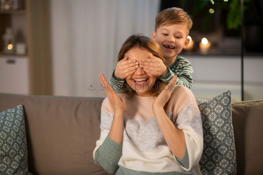 Similar – caucasian mother and son relaxing together on couch at home