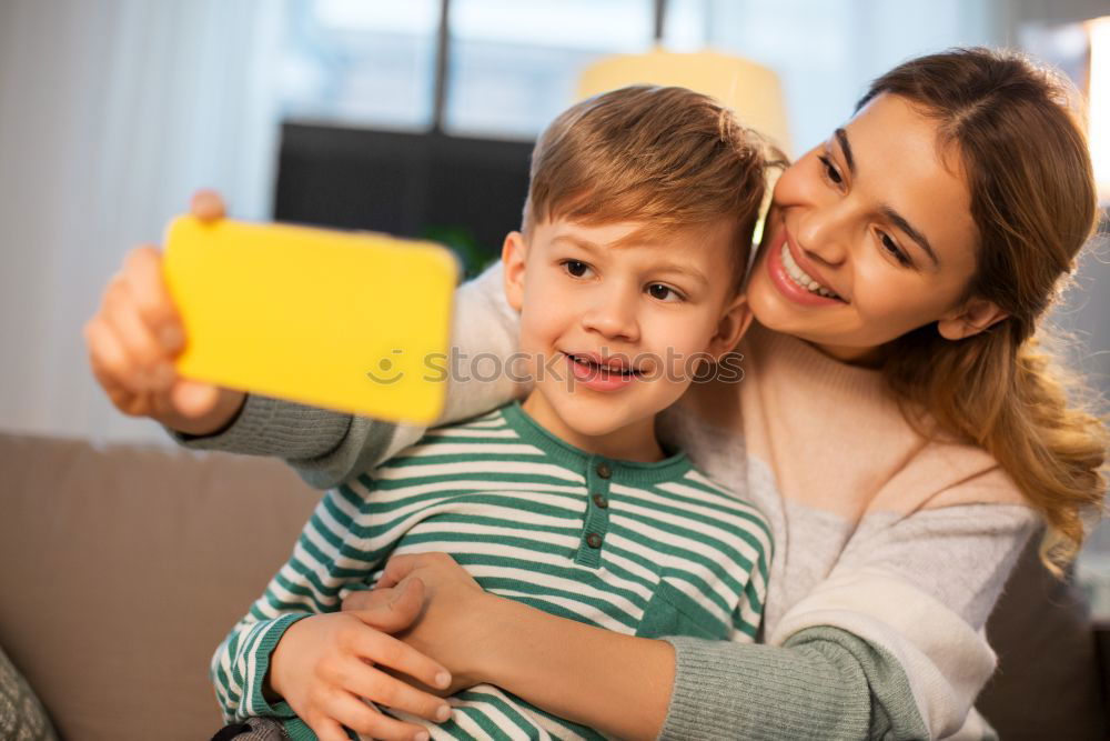 Similar – happy mother and toddler son using tablet