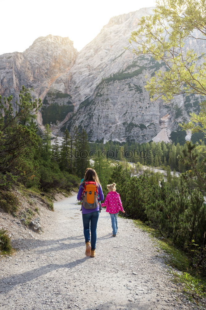 Similar – Boy and girl wandering in a forest on summer day