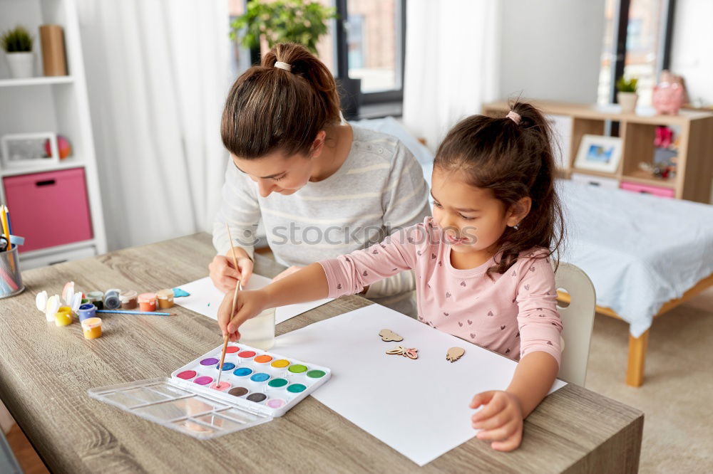 Similar – Image, Stock Photo Woman assembling furniture at home with Daughter