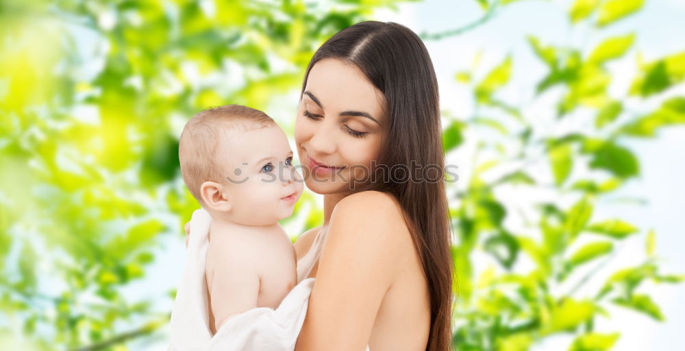 Similar – Image, Stock Photo Young happy mother embraced her cute little girl at canola field