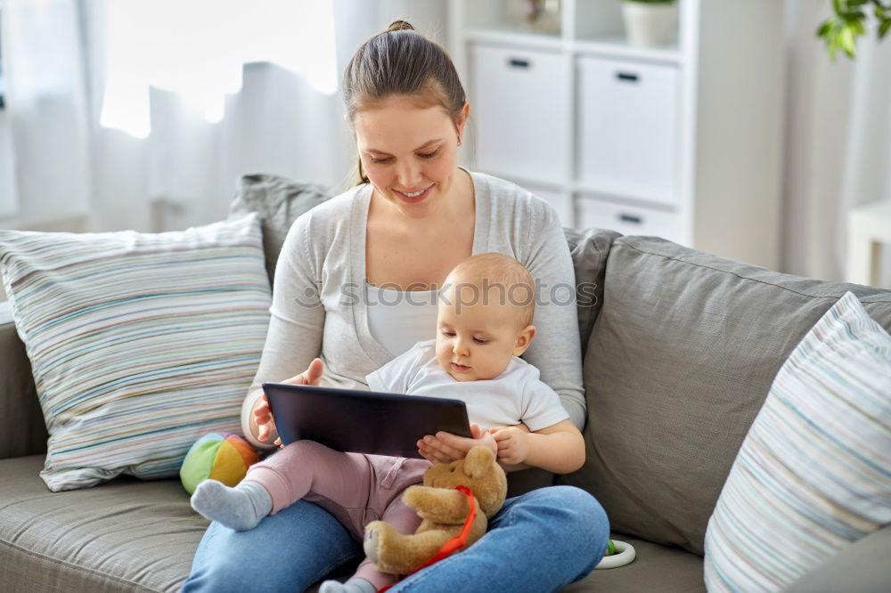 Similar – Mother breastfeed baby while playing with smartphone