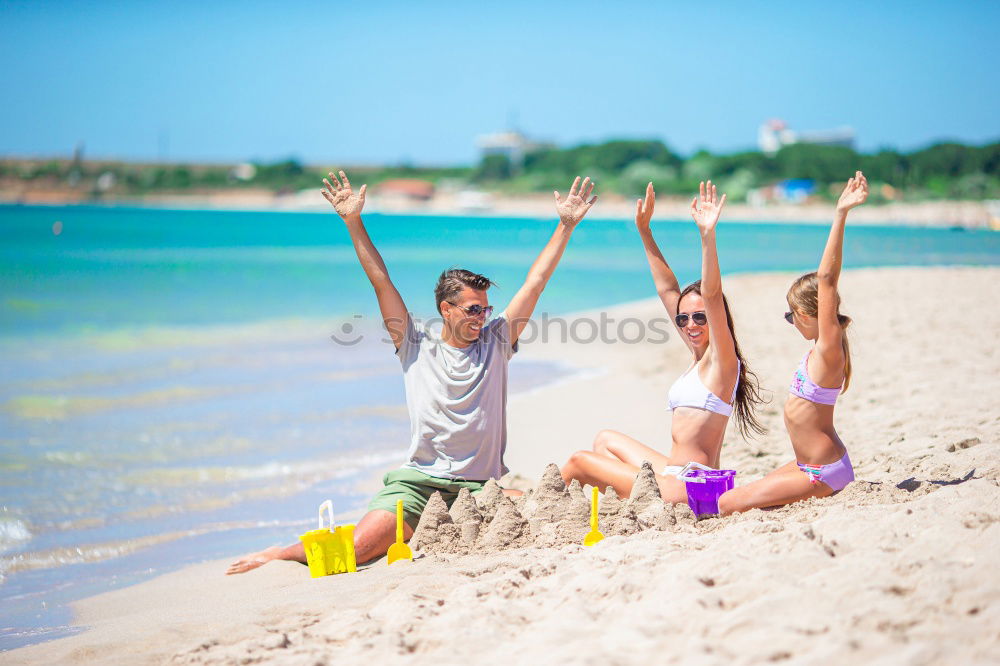 Similar – Image, Stock Photo Mother, father and little son on summer vacation at the seaside, They wearing snorkels and flippers while lying and playing on the beach