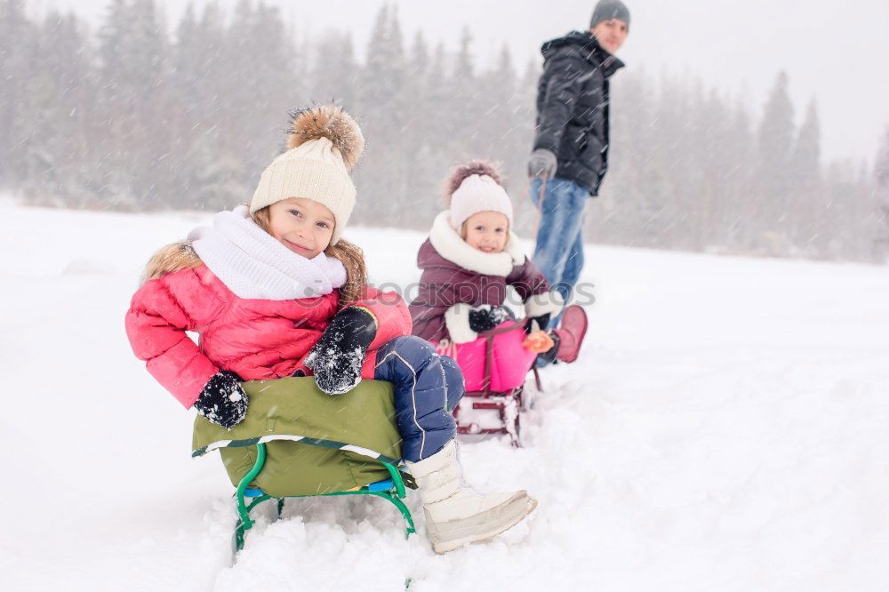 Similar – Image, Stock Photo Family spending time together outdoors in the winter. Parents with children gathered around the campfire preparing marshmallows and snacks to toasting over the campfire using wooden sticks