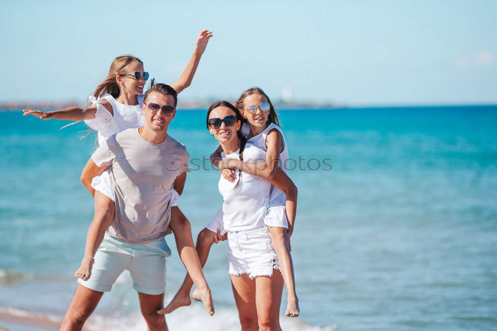 Similar – Mother and children playing on the beach at the day time. Concept of friendly family.