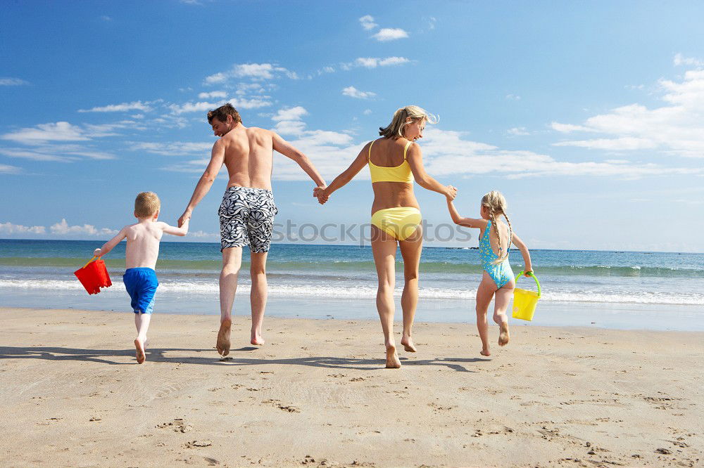 Similar – Mother and children playing on the beach at the day time. Concept of friendly family.