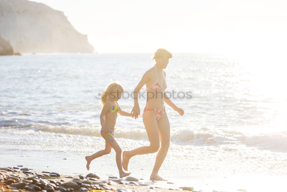 Similar – Happy best friends having good time on the beach together