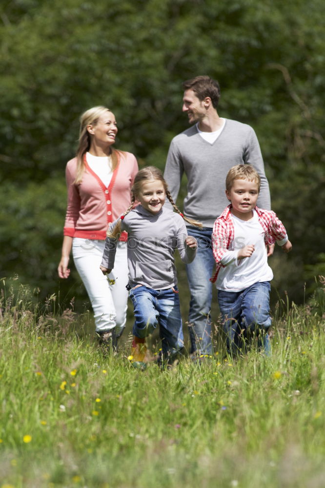 Similar – Image, Stock Photo Father and children walking on the road at the day time.