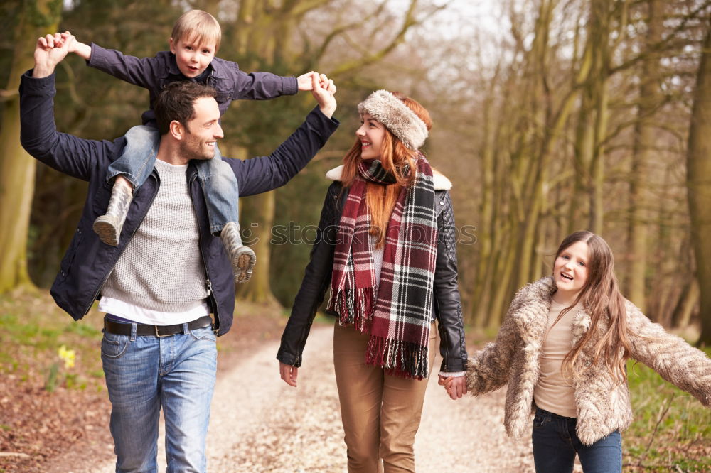 Similar – Image, Stock Photo Portrait of happy family enjoying together leisure over a wooden pathway into the forest